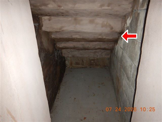 Inspection photograph looking along a crawlspace