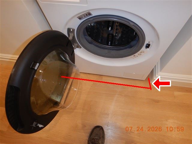 Inspection photograph of a washing machine door and gasket