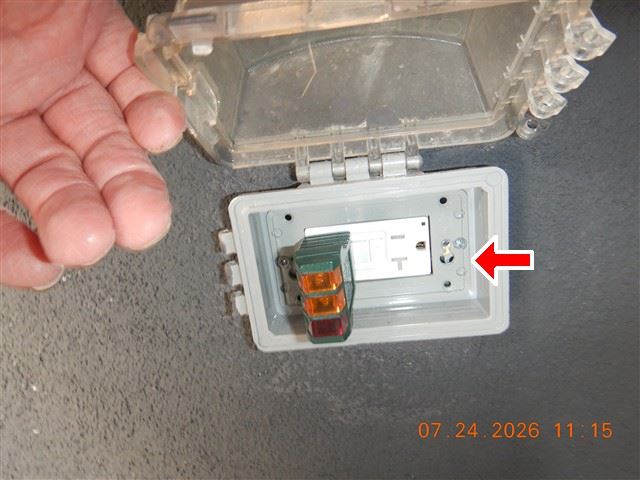 Inspection photograph of a receptacle tester plugged into an outlet