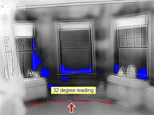 Thermal imaging photograph of a window wall showing cold bridging in blue