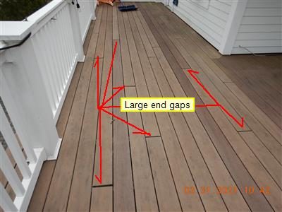 Composite deck boards on a front balcony with red lines fanning out to gaps; label reads Large end gaps.