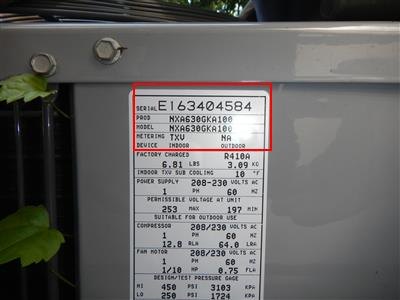 Air conditioner data plate with serial and model numbers outlined in red