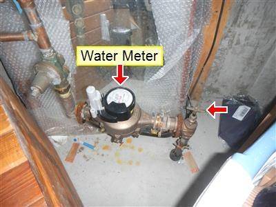 Basement water meter labelled 