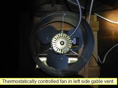 Round attic exhaust fan mounted in a gable vent; report label reads Thermostatically controlled fan in left side gable vent.