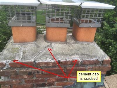 Brick chimney with three clay flues and metal caps, red arrows labeled cement cap is cracked