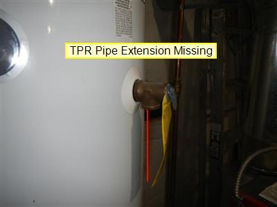 Side of a white water heater with a brass relief valve and no discharge pipe, with a red line and a report label.