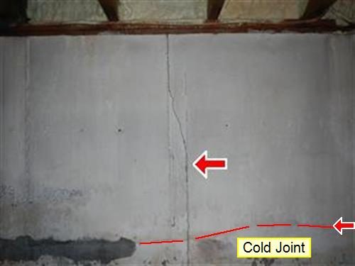Poured concrete basement wall with a vertical crack marked by a red arrow and a red line labelled Cold Joint.