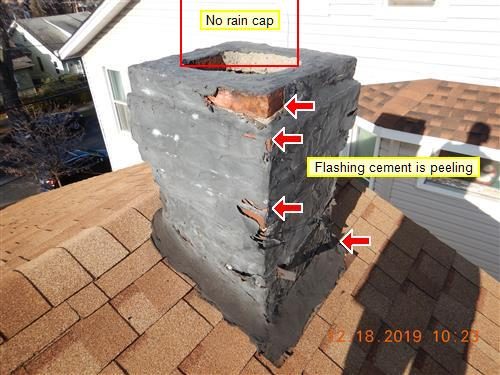 Brick chimney coated in black flashing cement peeling away, with red arrows and labels reading no rain cap and flashing cement is peeling.