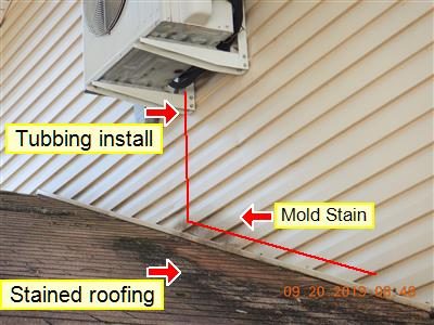 Air conditioner condenser on a wall bracket above stained roofing; labels read Tubbing install, Mold Stain and Stained roofing.